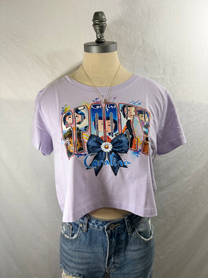 Spooky Coraline Cropped Graphic Tee (Lavender Dust)